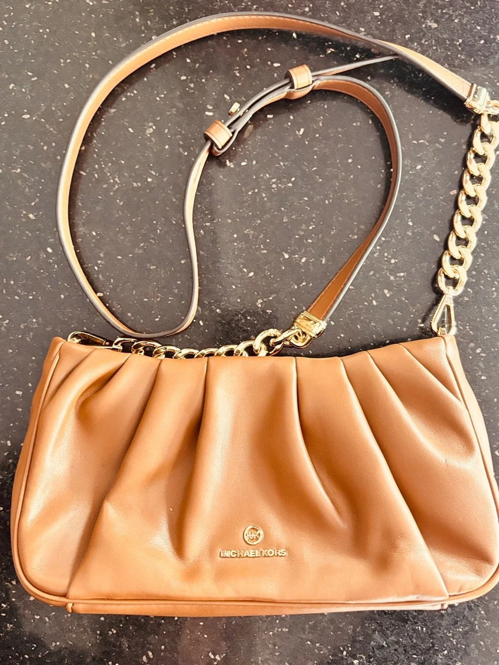 Michael Kors Hannah Small Convertible Clutch in a luggage brown color 10x6